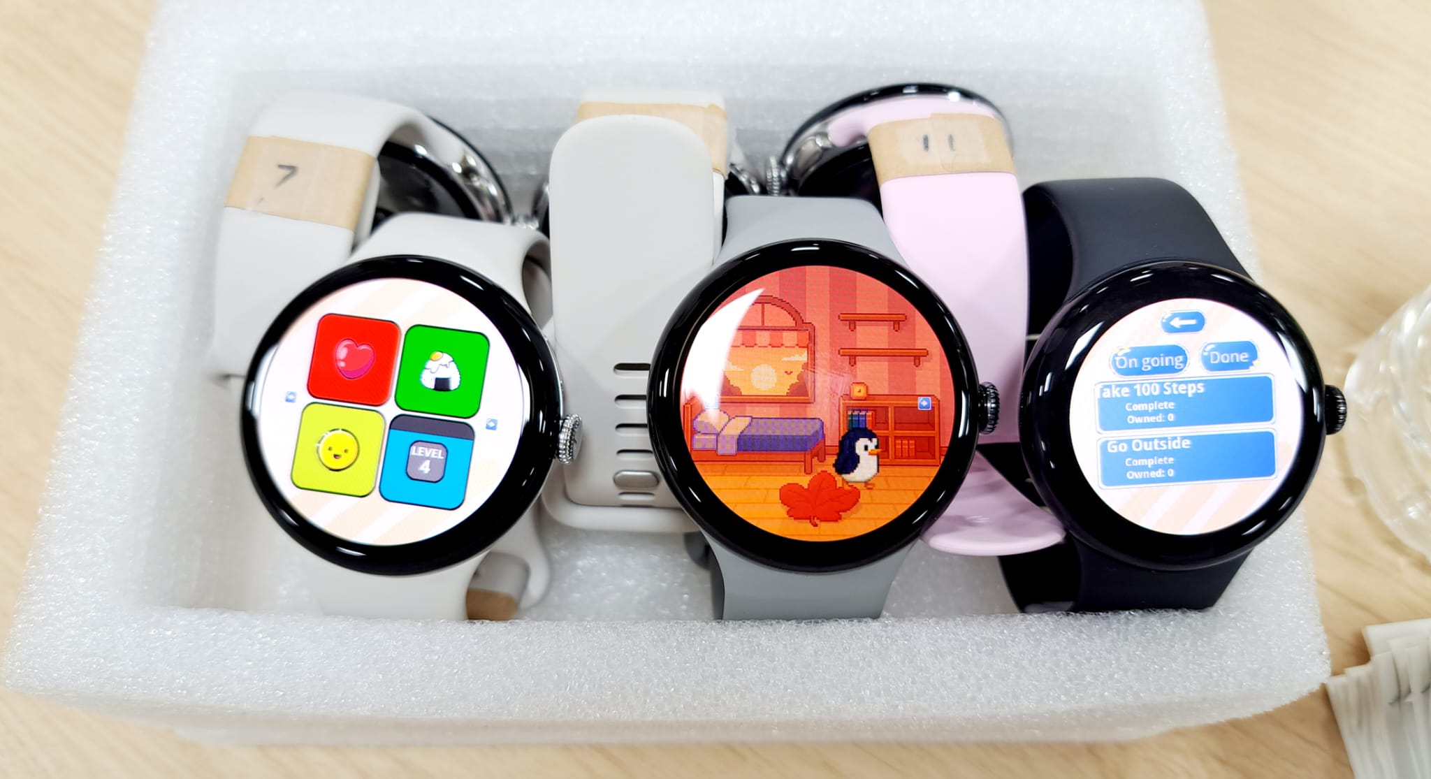 Smartwatch prototypes showing interfaces for a serious sleep hygiene game
